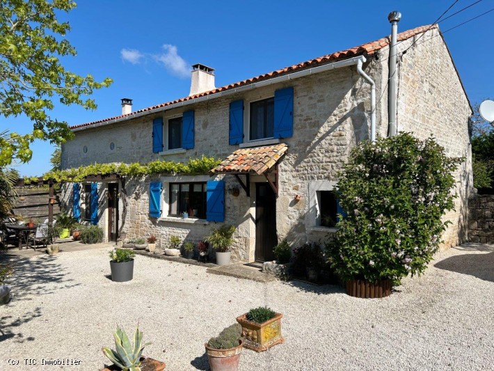 Attractive Character Stone House with Lovely Garden Close To Villefagnan