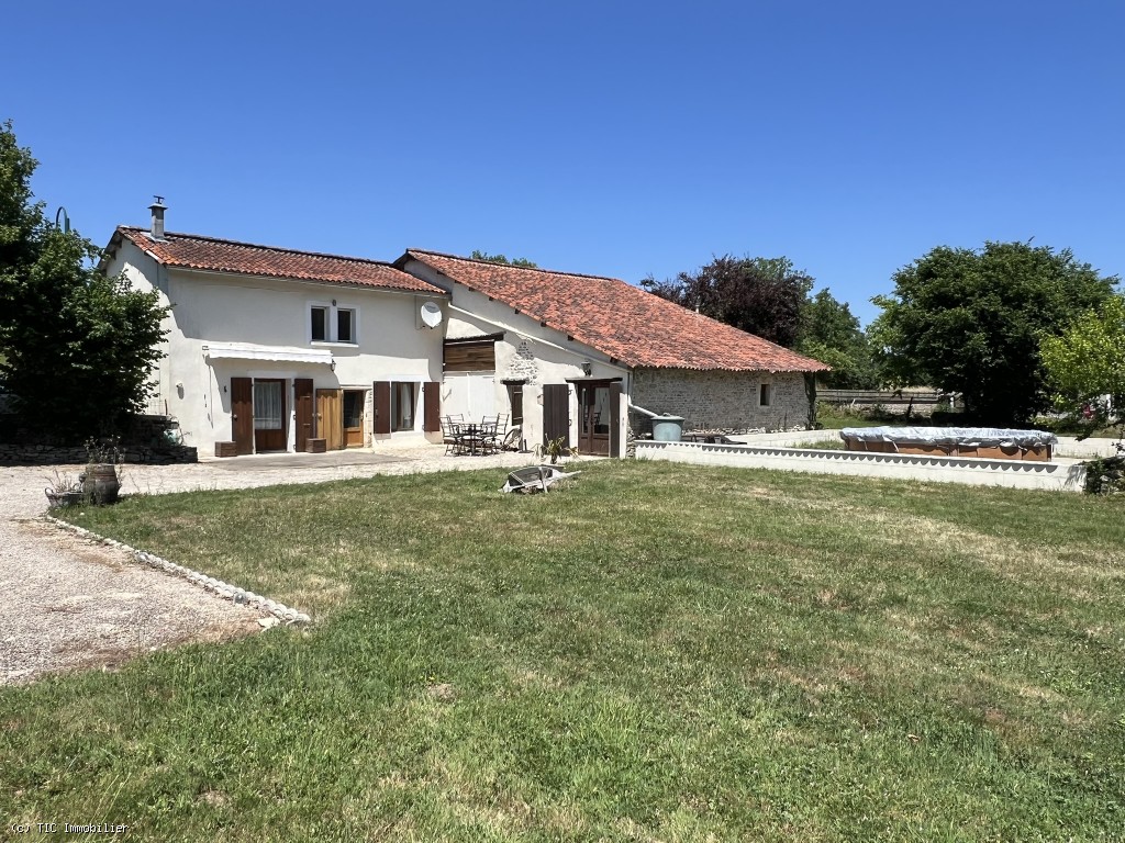 Riverside Property with Attached Barn and Gardens