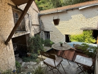 Townhouse in Ruffec with Outbuildings, Garden, and Great Potential
