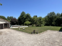 Riverside Property with Attached Barn and Gardens