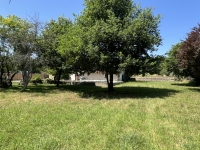 Riverside Property with Attached Barn and Gardens
