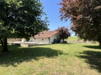 Riverside Property with Attached Barn and Gardens