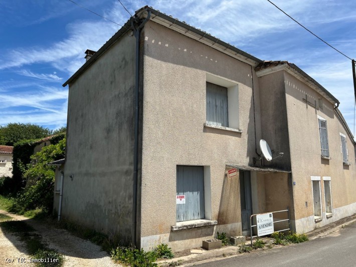 Village House with Large Outbuilding at rear